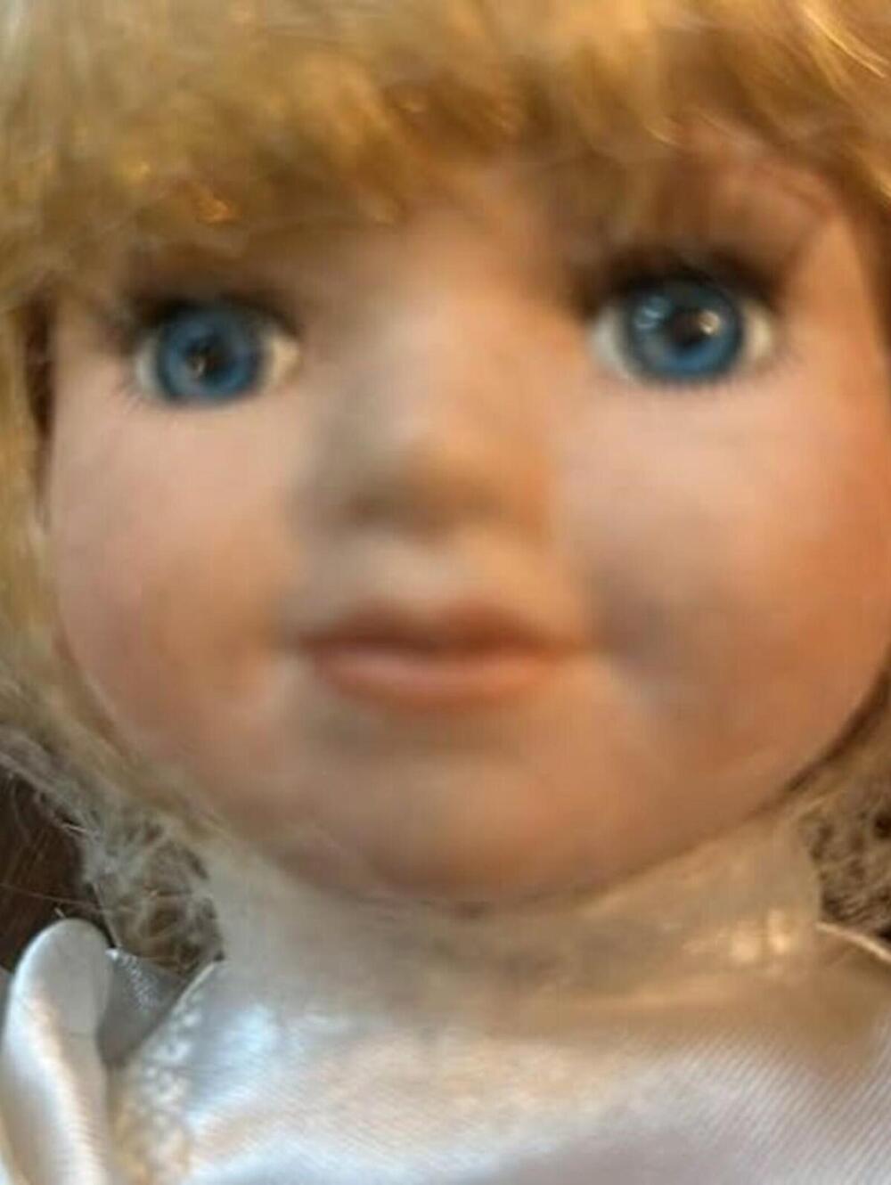 Porcelain Doll in White Satin Dress